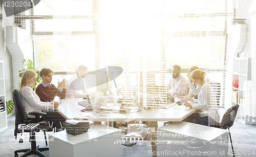 Image of business team with computers working at office