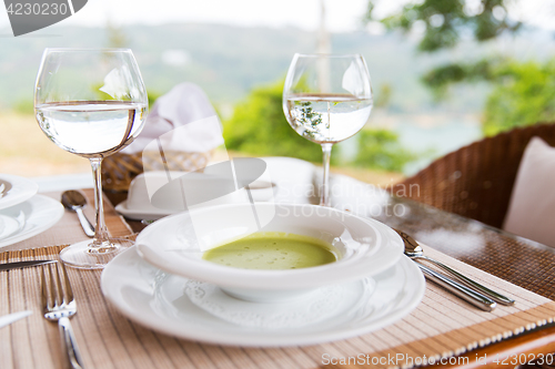 Image of plate of cream soup at restaurant