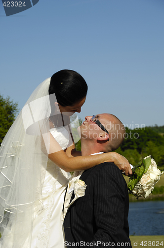 Image of Groom waiting for a kiss