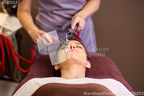 Image of woman having hydradermie facial treatment in spa