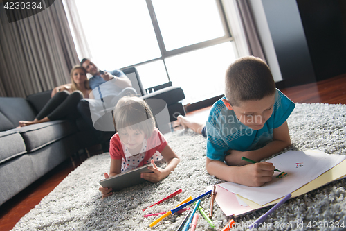Image of young couple spending time with kids