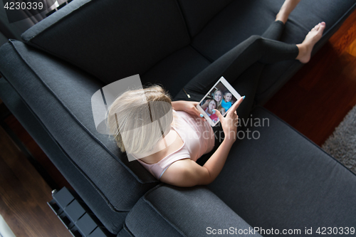 Image of woman using tablet in beautiful apartment