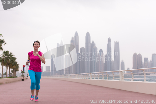 Image of woman running on the promenade