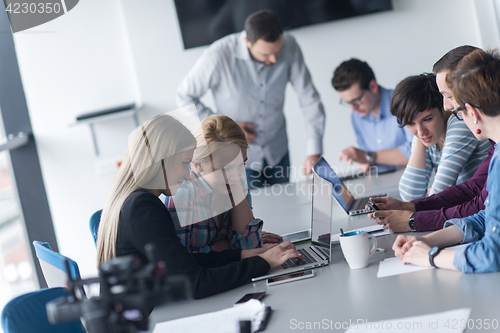 Image of Group of young people meeting in startup office