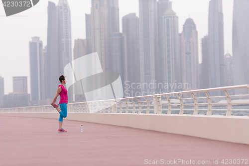 Image of woman stretching and warming up