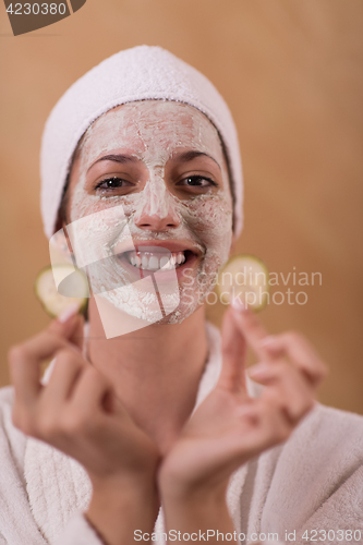 Image of Spa Woman applying Facial Mask