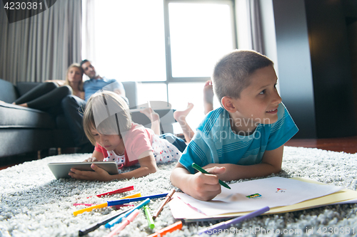 Image of young couple spending time with kids