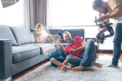 Image of Happy family playing a video game