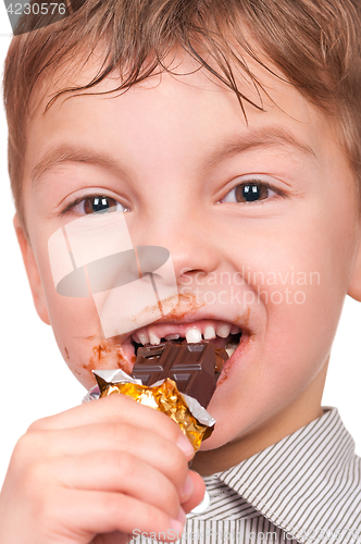 Image of Little boy eating chocolate