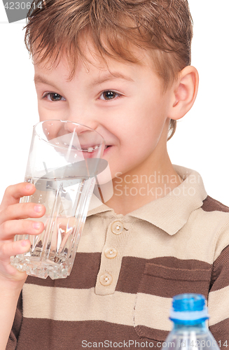 Image of Little boy with plastic bottle of water