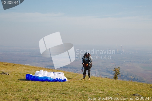 Image of Paraglider preparing for takeoff