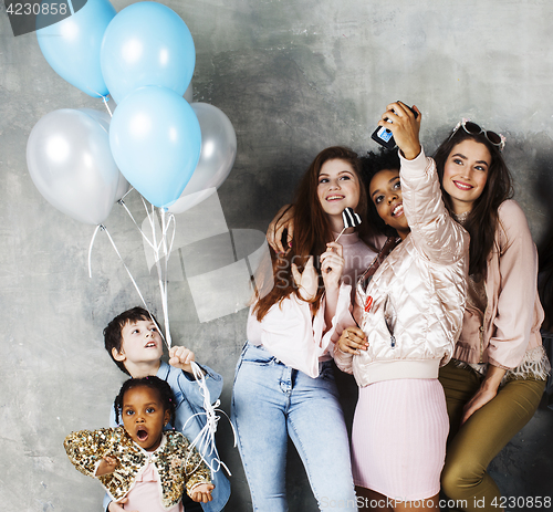 Image of Lifestyle and people concept: young pretty diversity nations woman with different age children celebrating on birth day party together happy smiling, making selfie. African-american, asian and caucasi