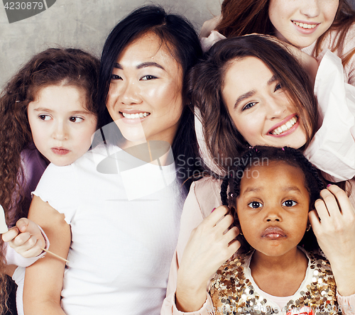 Image of Lifestyle and people concept: young pretty diversity nations woman with different age children celebrating on birth day party together happy smiling, making selfie. African-american, asian and caucasi