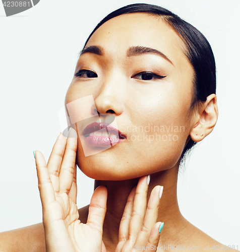 Image of young pretty asian woman with hands on face isolated on white background, stylish fashion healthcare people concept