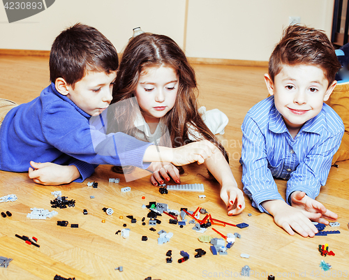 Image of funny cute children playing toys at home, boys happy smiling, first education role lifestyle 