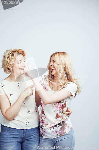 Image of mother with daughter together posing happy smiling isolated on white background with copyspace, lifestyle people concept