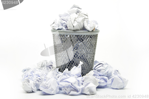 Image of Garbage bin with paper waste