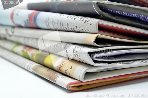 Image of Newspapers folded and stacked