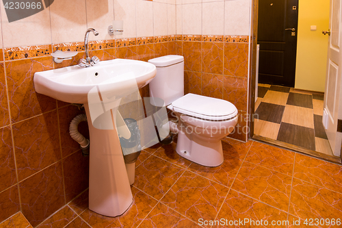 Image of Bathroom in the hotel, washbasin and toilet
