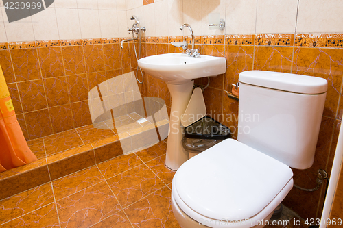 Image of Bathroom combined with toilet in the hotel, shower, sink and toilet