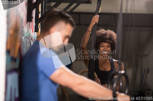 Image of Portrait of multiethnic couple  after workout at gym