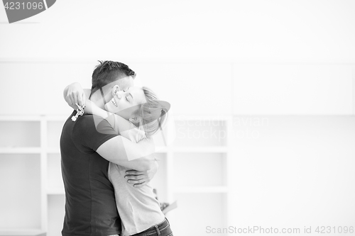 Image of happy Young couple moving in new house