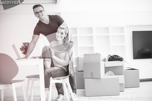 Image of Young couple moving in a new home