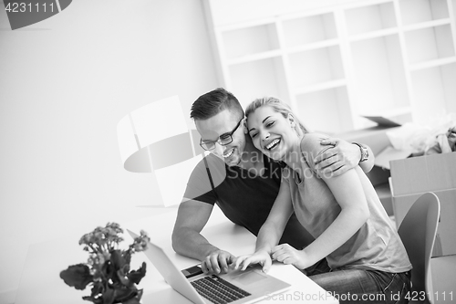 Image of Young couple moving in a new home