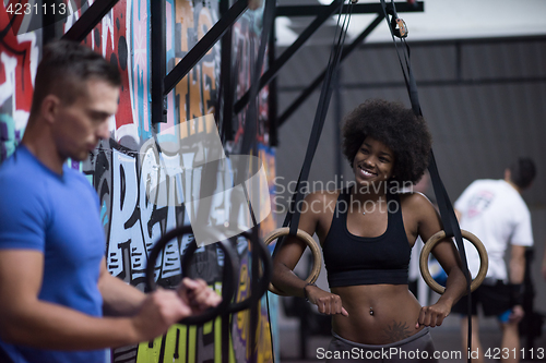 Image of Portrait of multiethnic couple  after workout at gym