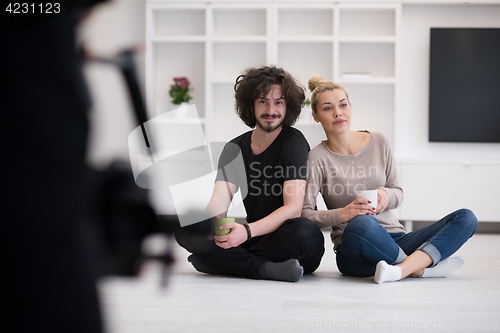 Image of young couple in their new home