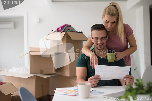 Image of Young couple moving in a new home