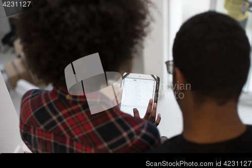 Image of african american couple using tablet at home