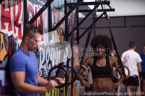 Image of Portrait of multiethnic couple  after workout at gym