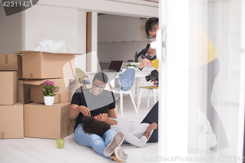 Image of African American couple relaxing in new house