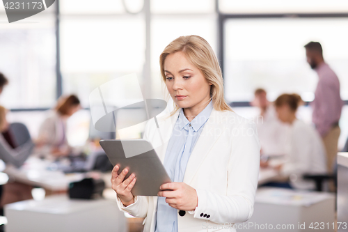 Image of businesswoman with tablet pc computer at office