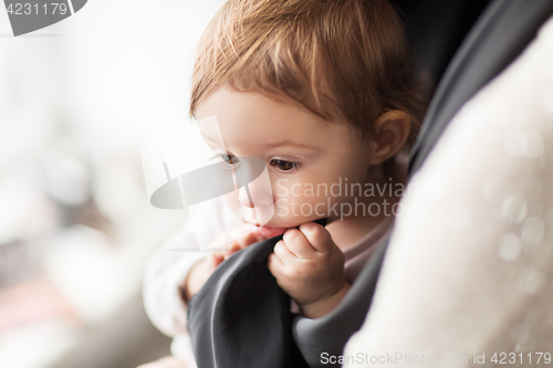 Image of close up of sweet little baby girl with mother