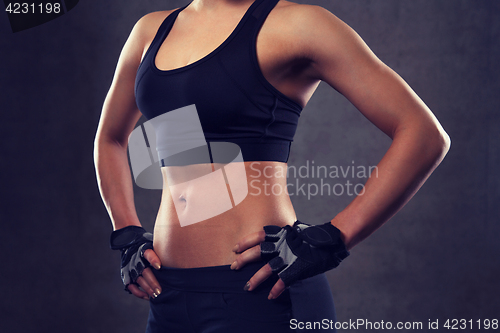Image of close up of young woman body in gym