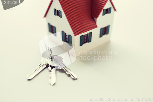 Image of close up of home model and house keys