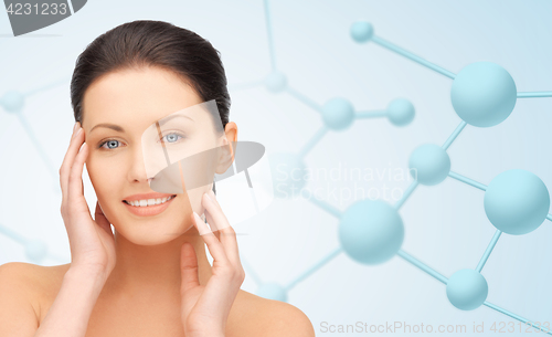 Image of beautiful young woman face with molecules