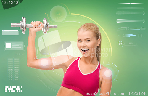 Image of happy sporty woman with dumbbell flexing biceps