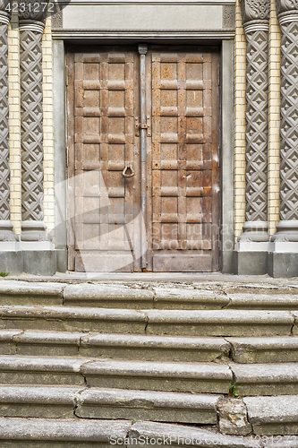 Image of old stairs and door of the church