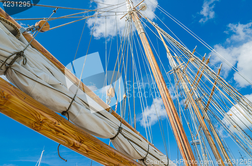 Image of Folded sail and mast on an old sailboat