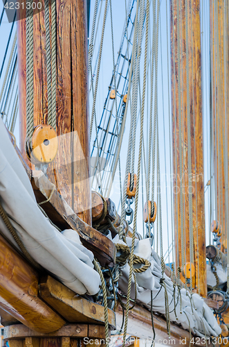 Image of Folded sail and mast on an old sailboat