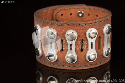 Image of Brown leather bracelet isolated on a black