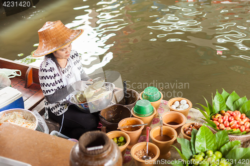 Image of Thai woman preparing food