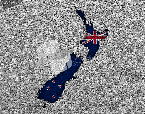 Image of Map and flag of New Zealand on poppy seeds,