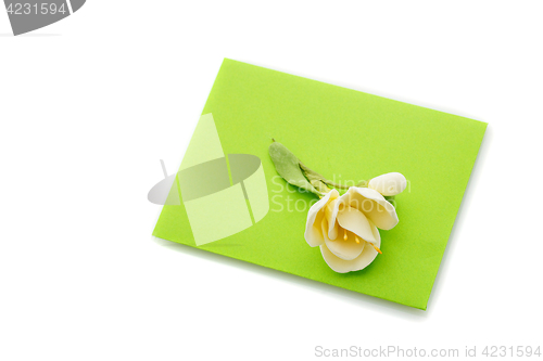 Image of Close up of green envelope with flower