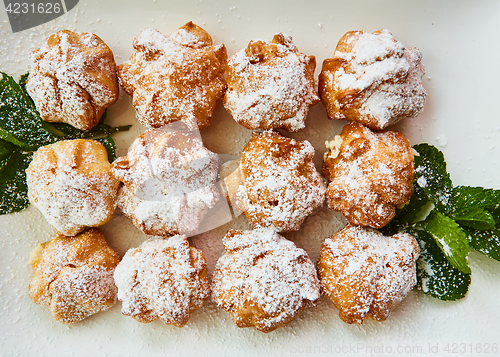 Image of Fresh homemade profiteroles with cream pastry.