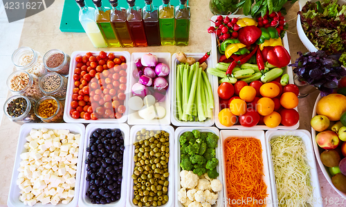 Image of Salad Bar Fresh Vegetables sliced Top view Tomato Carrot Celery Cucumber Cherry tomato Sweet pepper.