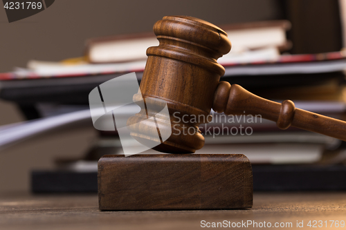 Image of Folder, judge\'s hammer on table